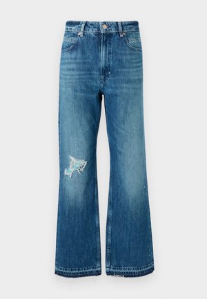 Blue denim flared jeans with a frayed hem and a distressed patch on the left thigh. Features a classic five-pocket design and metal buttons.
