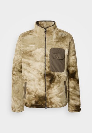 Beige fleece jacket with a high collar, zip closure, and left chest pocket in olive green. Features a soft, textured surface with a tie-dye pattern.