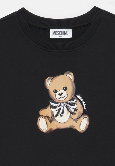 Felpa nera con un orsetto cartoon e un papillon di paillettes, stampata in diverse tonalità di marrone sul davanti. Etichetta del marchio sul colletto.