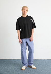 Alpha Industries FLOCK LOGO  - Triko s potiskem - black