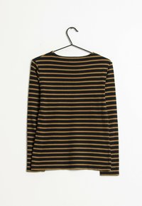 Långärmad skjorta i svart och senapsgula ränder, med rundad nacke, mjukt tyg och rak nederkant med sidoventiler.