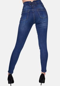 Hoog-waisted skinny jeans in donkerblauwe denim, met een gerimpelde tailleband, achterzakken en een slim fit tot aan de enkels.