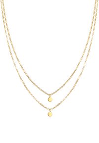 Gouden lagenketting met twee fijne kettingen, elk met een cirkelvormige hanger, die een gladde, gepolijste afwerking toont.