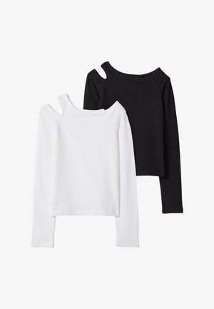 Deux hauts à manches longues en noir et blanc avec une découpe asymétrique près de l'encolure, posés à plat sur un fond blanc.