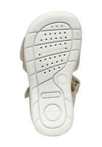 Suola di scarpa in gomma bianca con superficie testurizzata, dotata di un battistrada a pattern e fori di ventilazione. I marchi includono "GEOX" e "FLEXI SYSTEM."