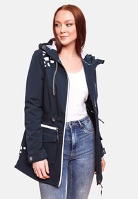 Dark navy waterproof jacket with a hood, featuring silver hardware, white zippers, and geometric patterns on the shoulders.