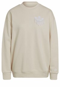 Beige sweatshirt met lange mouwen en ronde hals, met een wit ingezoomd Adidas trefoil-logo op de borst en pols.