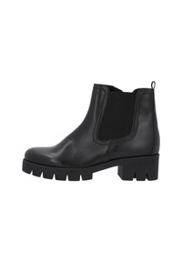 Bottines en cuir noir avec des panneaux élastiques sur les côtés, bout rond et semelle épaisse à bande de roulement. Dispose d'une languette à l'arrière pour un enfilage facile.