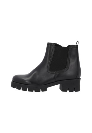 Bottines en cuir noir avec des panneaux élastiques sur les côtés, bout rond et semelle épaisse à bande de roulement. Dispose d'une languette à l'arrière pour un enfilage facile.