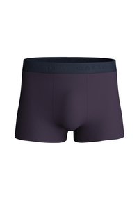 Boxer shorts di un viola scuro con una finitura in tessuto liscia. Presentano un ampio elastico navy texturizzato con il nome del marchio "CALIDA" in rilievo.