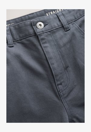 Dark gray straight-fit pants made from textured fabric. Features a metal button and stitching details along the waistband and zipper area.