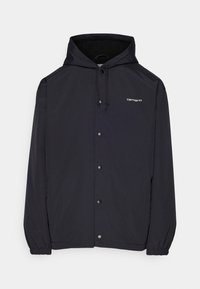 Svart huva jacka med tryckknappar, dragsko huva, elastiska ärmmuddar och liten vit "carhartt" logotyp på bröstet.