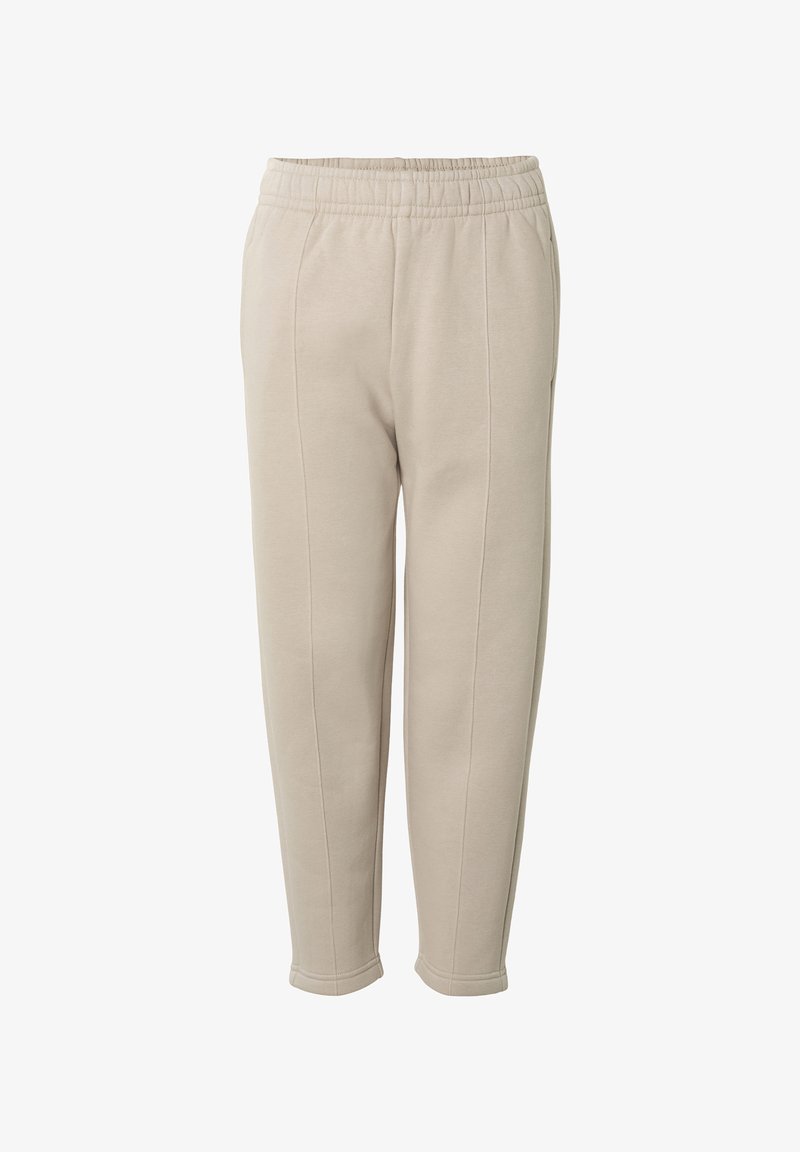 Pantalon de jogging beige fuselé avec taille élastique et détails de coutures, fabriqué dans un tissu doux et confortable.