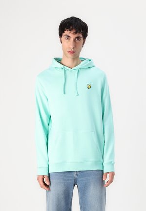 Mintgrön hoodie med ficka fram, dragsko på huvan och en liten gul logotyp på bröstet. Tillverkad av mjukt, lätt tyg.