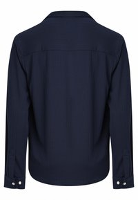 Navy long-sleeve shirt with a subtle vertical stripe pattern, classic collar, and buttoned cuffs. Smooth fabric texture, no visible fastenings.