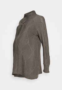 Överdimensionerad tröja med hög krage i mörk olivgrön. Funkar med ett texturerat stickmönster med ribbade detaljer och långa ärmar. Mjukt, varmt material.