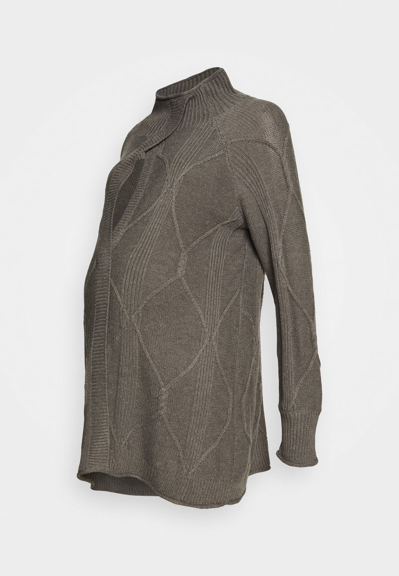 Överdimensionerad tröja med hög krage i mörk olivgrön. Funkar med ett texturerat stickmönster med ribbade detaljer och långa ärmar. Mjukt, varmt material.