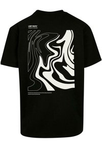 Black cotton t-shirt featuring abstract white wave patterns on the back, with brand name and text printed above the design.