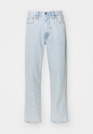Light blue straight-leg jeans made of denim, featuring five pockets, a zip fly with button closure, and subtle fading on the fabric.