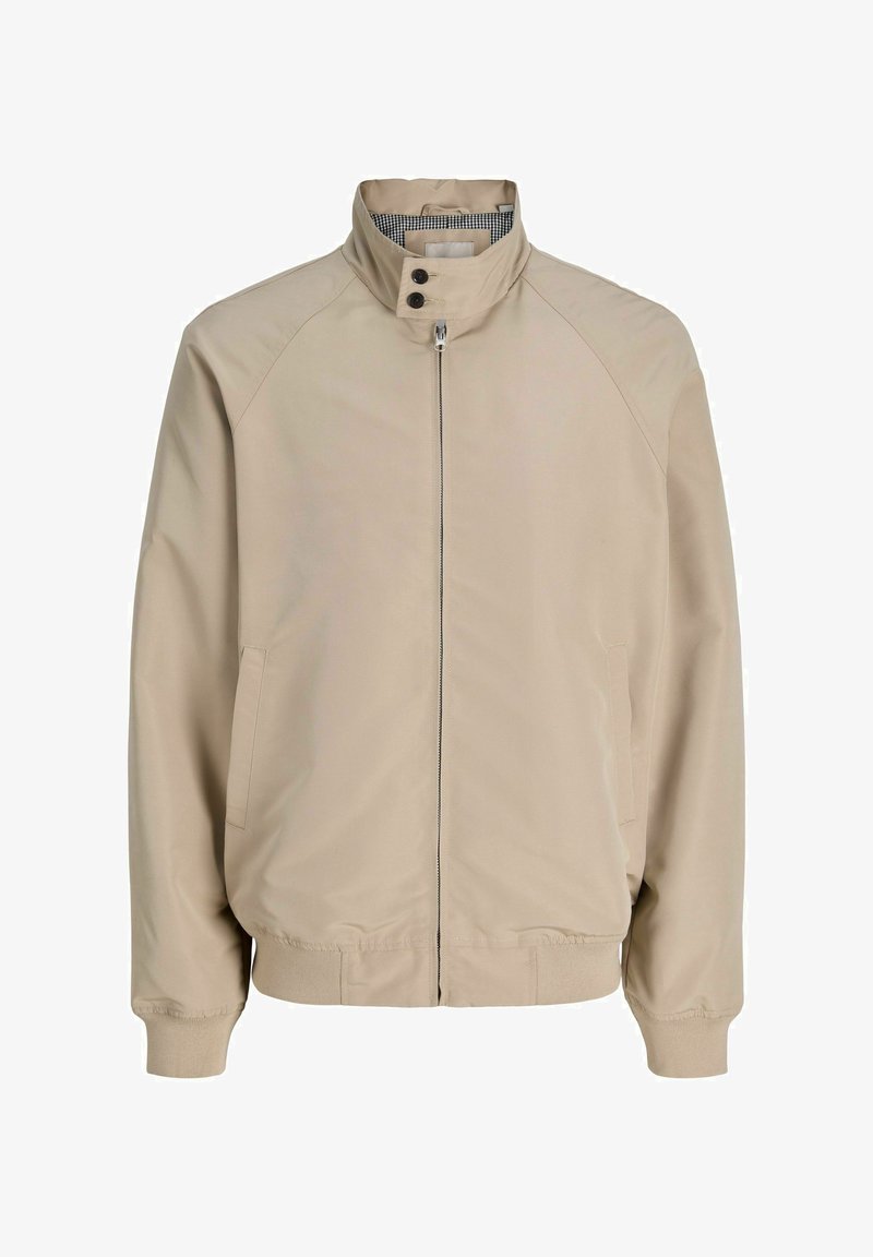 Beige lynlåsjakke med ståkrave, to knapper, sidelommer, ribstrikkede ærmer og kant, foret med ternet stof.