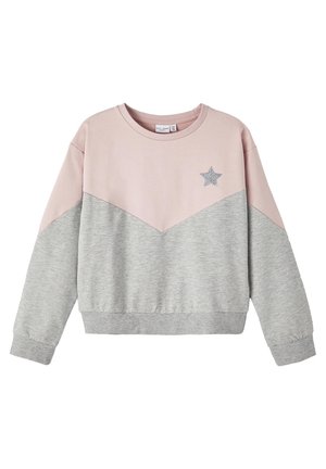 Langärmliges Sweatshirt mit pinkem Oberteil und grauem Unterteil, mit einem kleinen silbernen Glitzerstern auf der linken Brust.