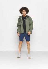 The North Face QUEST JACKET - Casaco impermeável - mottled dark green