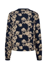 Haut bleu marine à manches longues avec broderie florale beige couvrant tout le dos et les manches.