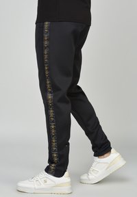 SIKSILK Tracksuit bottoms - black
