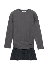 Siva majica z dolgimi rokavi z nabranim pasom, združena s črno-zeleno karo krilo. Mehka tkanina z udobnim krojem.