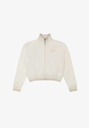 Chaqueta blanca recortada con cremallera, con cuello, puños, dobladillo y bolsillos laterales acanalados a rayas beige, con un sutil logo "Lee" en el pecho.