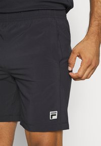 Fila SHORTS FILIP - Spordišortsid - black