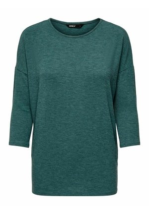 Sweter w kolorze zielonkawym (teal), z długimi rękawami, okrągłym dekoltem, luźnym fasonem i lekko opuszczonymi ramionami.