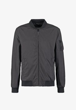 Must must pommikindluse jope esikinnitus lukuga, soonikkoes krae, varrukateotsad, alläär ning lukuga tasku vasakul varrukal.