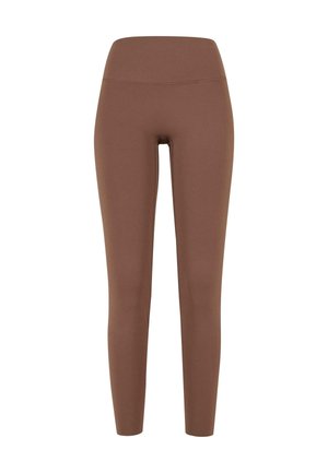 Ruske leggingsejä korkean vyötärön kanssa, jotka on valmistettu sileästä, joustavasta kankaasta. Yksinkertainen muotoilu ilman kuvioita tai näkyviä kiinnikkeitä.