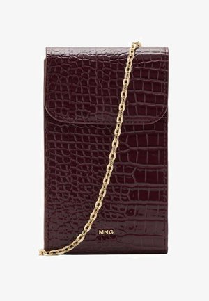 Burgundy crossbody bag with a glossy crocodile texture, gold chain strap, and a front flap closure featuring a logo detail.