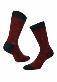 Bawełniane skarpetki w burgundowym kolorze z czarnymi akcentami na palcach i piętach. Charakteryzują się całościowym wzorem małych nożyczek w beżowym i granatowym kolorze. Długość do połowy łydki.