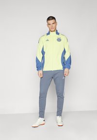 adidas Performance AJAX AMSTERDAM PRESENTATION JACKET - Træningsjakke - pulse yellow