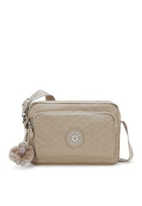 Beige crossbody bag made of textured fabric, featuring a zippered compartment, logo patch, and a fur-lined monkey keychain accent.