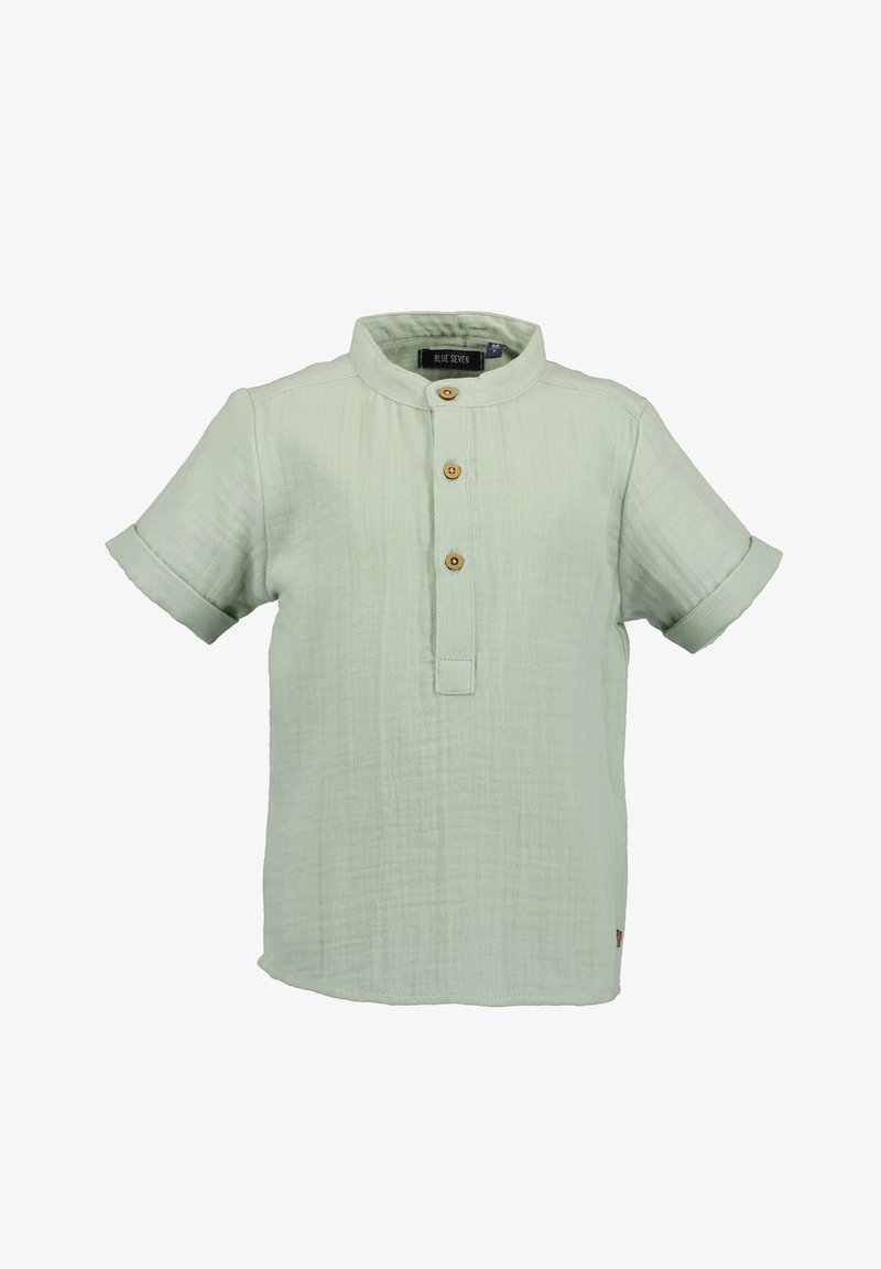 Chemise à manches courtes vert clair en tissu texturé, dotée d'un col montant, d'une patte de boutonnage à l'avant avec des boutons en bois et de manches retroussées.