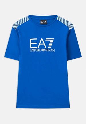 Blue short-sleeve t-shirt made of cotton featuring a round neckline and white "EA7 EMPORIO ARMANI" logo with striped accents on shoulders.