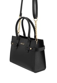 Black handbag made of textured leather with gold hardware. Features dual handles and a detachable chain strap. Subtle logo detail on front.