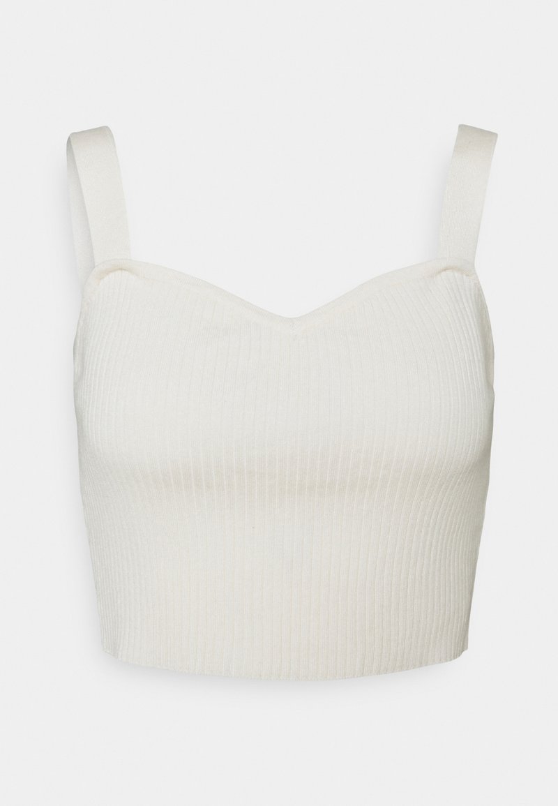 Geribbelde, cropped top in off-white met een sweetheart halslijn en verstelbare bandjes. De stof lijkt zacht en rekbaar voor comfort.