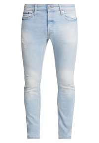 Jeans skinny in denim blu chiaro con leggere sfumature e dettagli strappati. Progettati con una classica costruzione a cinque tasche e chiusura con zip.