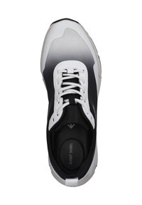 Black and white athletic shoe with a textured upper, gradient design, white laces, and a padded collar. Features a logo on the insole.