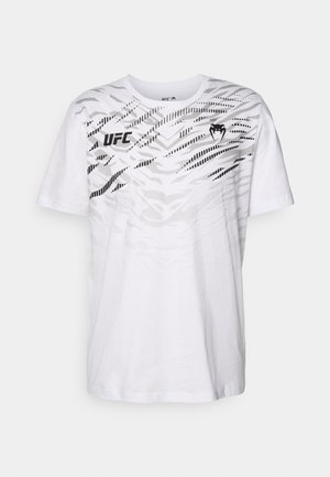 White cotton t-shirt featuring a black abstract wave pattern, with a "UFC" logo on the left chest and a heart graphic in the center.