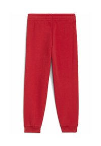 Pantaloni sportivi rossi realizzati in un morbido e elastico tessuto. Presentano una vita elasticizzata e polsini a coste alla caviglia. Tessuto complessivamente liscio.