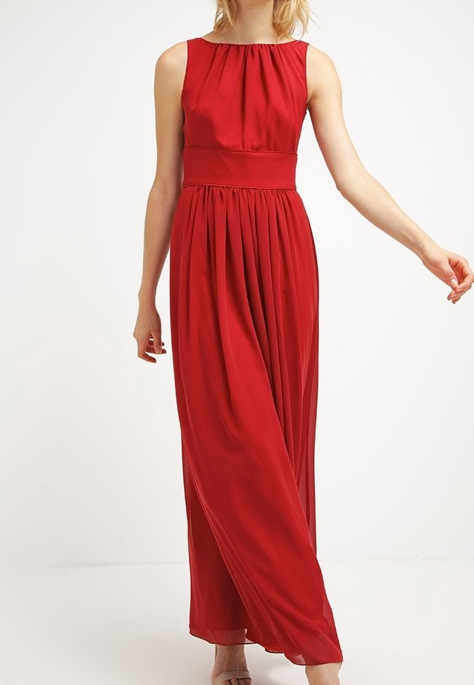 Robe longue rouge sans manches, avec une jupe plissée et une taille cintrée. Confectionnée en tissu lisse avec un léger éclat.