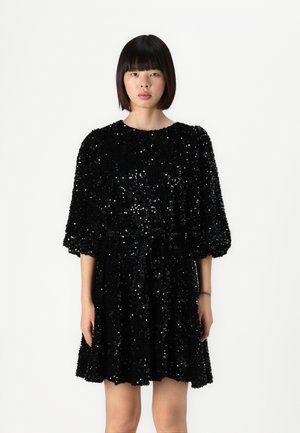Black sequin dress with puffed short sleeves and a round neckline. The dress features a cinched waist with a tied belt, creating a flared silhouette.