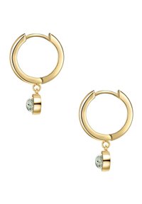 Zelta riņķa auskari ar gludu apdari, kas papildināti ar pakārtiem teksturētiem zaļiem akmeņiem, kuri ir nostiprināti ar apaļu furnitūru.