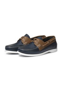 Marineblaue Lederbootsschuhe mit braunen Lederelementen, weißer Gummisohle, abgerundeter Spitze und kontrastierenden Nähdetails. Klassisches Design.